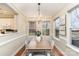 Charming dining room with natural light, a stylish chandelier, and seating for four at 626 E 9Th St, Charlotte, NC 28202