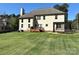 Spacious backyard with a deck, a trampoline, and well-maintained lawn at 712 Kenway Loop, Mooresville, NC 28117
