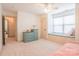 Cozy bedroom features a built-in window seat and ample natural light at 712 Kenway Loop, Mooresville, NC 28117