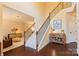 Elegant foyer featuring hardwood floors, a staircase with iron spindles and decorative accents, and a warm inviting space at 712 Kenway Loop, Mooresville, NC 28117
