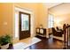 Inviting foyer features hardwood floors, sidelights flanking the door and an adjacent cozy living area at 712 Kenway Loop, Mooresville, NC 28117