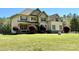 Inviting two-story home with a well-maintained lawn and a welcoming front porch at 712 Kenway Loop, Mooresville, NC 28117
