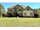 Charming two-story home with a well-manicured lawn and inviting front entrance at 712 Kenway Loop, Mooresville, NC 28117