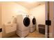 Laundry room with modern washer and dryer and utility sink at 712 Kenway Loop, Mooresville, NC 28117