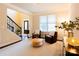 Inviting living room features hardwood floors, a bright window, and comfortable seating creating a cozy ambiance at 712 Kenway Loop, Mooresville, NC 28117