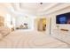 Spacious primary bedroom featuring tray ceilings, sitting area, and ensuite access at 712 Kenway Loop, Mooresville, NC 28117