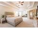 Bright and airy main bedroom with a decorative headboard and large windows at 712 Kenway Loop, Mooresville, NC 28117