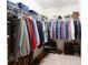 Well-organized walk-in closet with shelves and hanging racks for clothing and shoes at 712 Kenway Loop, Mooresville, NC 28117