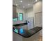 Modern kitchen features stainless steel appliances, granite counters, and ample cabinet space at 765 N Alexander St, Charlotte, NC 28202