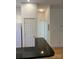 An open kitchen view featuring black countertops and stainless steel appliances at 765 N Alexander St, Charlotte, NC 28202