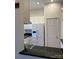 Kitchen view featuring white cabinetry and a stainless steel refrigerator at 765 N Alexander St, Charlotte, NC 28202