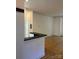 Open-concept kitchen and living room featuring a breakfast bar at 765 N Alexander St, Charlotte, NC 28202