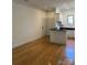 A view of the open-concept living room with hardwood floors and recessed lighting at 765 N Alexander St, Charlotte, NC 28202