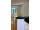 Bright living room with windows, hardwood floors, and a view of the open-concept kitchen at 765 N Alexander St, Charlotte, NC 28202
