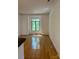 Spacious living room with hardwood floors and a large window offering natural light at 765 N Alexander St, Charlotte, NC 28202