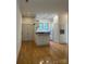 Bright living room with hardwood floors, access to the kitchen, and recessed lighting at 765 N Alexander St, Charlotte, NC 28202