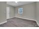 This bedroom includes hardwood floors, neutral walls, a window, closet and a ceiling fan at 7921 Fairmont Dr, Waxhaw, NC 28173