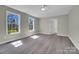Spacious bedroom with neutral paint, hardwood floors, and natural light at 7921 Fairmont Dr, Waxhaw, NC 28173
