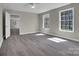 Sunlit bedroom with hardwood floors and neutral paint at 7921 Fairmont Dr, Waxhaw, NC 28173