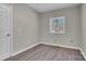 Cozy bedroom with neutral paint, hardwood floors, and natural light at 7921 Fairmont Dr, Waxhaw, NC 28173