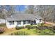 Charming single-story home with white siding and a well-manicured front yard at 7921 Fairmont Dr, Waxhaw, NC 28173
