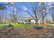 Inviting single-story home featuring a manicured lawn, trimmed bushes and a brick walkway to the front door at 7921 Fairmont Dr, Waxhaw, NC 28173