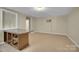 Bright eat-in kitchen, featuring breakfast bar and durable tile flooring at 7921 Fairmont Dr, Waxhaw, NC 28173