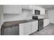 Charming kitchen with white cabinets, stainless appliances and a neutral backsplash at 7921 Fairmont Dr, Waxhaw, NC 28173