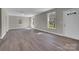 Spacious living room with durable floors, neutral paint, and bright, natural light at 7921 Fairmont Dr, Waxhaw, NC 28173