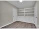 Office space with built-in shelving, cabinets, and neutral paint at 7921 Fairmont Dr, Waxhaw, NC 28173