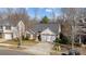 Attractive front exterior featuring a well-maintained lawn, a two-car garage, and traditional architectural details at 8218 Deodora Cedar Ln, Charlotte, NC 28215