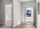 Inviting foyer with wood-look flooring, neutral paint, and a view into the adjacent room at 910 Von Buren Blvd, Rock Hill, SC 29730