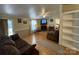 Living area with fireplace, hardwood floors, and built-in shelving at 92 Foot Hill Dr, Taylorsville, NC 28681