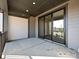 Covered back patio with sliding glass doors and concrete flooring at 95 Seven Oaks Lndg, Belmont, NC 28012