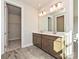 Double vanity bathroom with modern wood cabinets at 95 Seven Oaks Lndg, Belmont, NC 28012