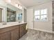 Double vanity bathroom with a large mirror and window at 95 Seven Oaks Lndg, Belmont, NC 28012