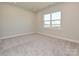 Spacious bedroom with carpeted floor and window at 95 Seven Oaks Lndg, Belmont, NC 28012