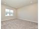 Bright bedroom with neutral walls and carpet at 95 Seven Oaks Lndg, Belmont, NC 28012