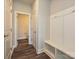 Bright entry hall with built-in bench, storage, powder room at 95 Seven Oaks Lndg, Belmont, NC 28012