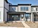 Two-story townhome with modern exterior, front porch, and landscaping at 95 Seven Oaks Lndg, Belmont, NC 28012