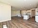 Open concept kitchen with island and hardwood floors at 95 Seven Oaks Lndg, Belmont, NC 28012