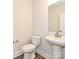 Clean powder room with pedestal sink and toilet at 95 Seven Oaks Lndg, Belmont, NC 28012