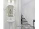 Elegant powder room with pedestal sink and modern fixtures at 11311 Magpie Ct # 2, Charlotte, NC 28215