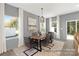 Dining room with wood table, gray walls, and access to backyard patio at 11311 Magpie Ct # 2, Charlotte, NC 28215