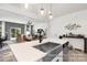 Open concept kitchen with large island, stainless steel appliances, and view into the living room at 11311 Magpie Ct # 2, Charlotte, NC 28215