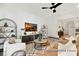 Spacious living room featuring stylish furniture and a large TV at 11311 Magpie Ct # 2, Charlotte, NC 28215