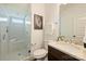 Modern bathroom featuring a glass-enclosed shower, marble countertop and decorative touches at 1211 Pinecrest Ave, Charlotte, NC 28205