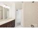 Bathroom with a shower, a single vanity with storage, and neutral walls at 1211 Pinecrest Ave, Charlotte, NC 28205