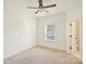 Vacant bedroom with a ceiling fan, neutral walls, and a window providing natural light at 1211 Pinecrest Ave, Charlotte, NC 28205
