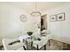 Bright dining room with a modern chandelier, glass table, and stylish decor at 1211 Pinecrest Ave, Charlotte, NC 28205